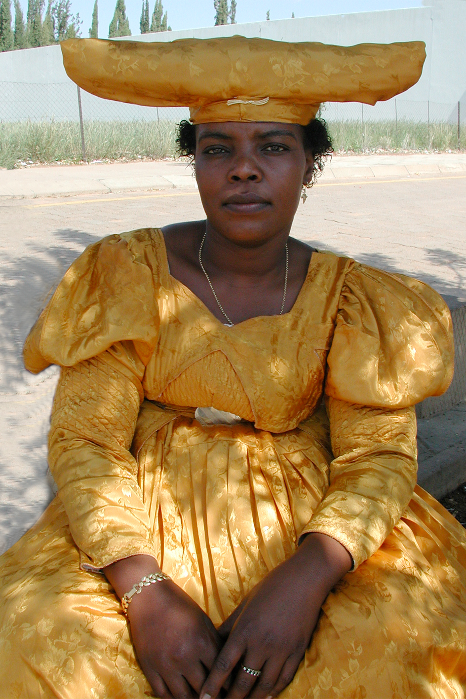 Herero woman waiting for the bus in Gobabis